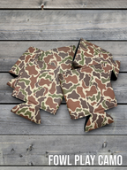 Fowl Play Camo Premium Leatherette can coolers in a feather camouflage pattern, laid flat and collapsed.