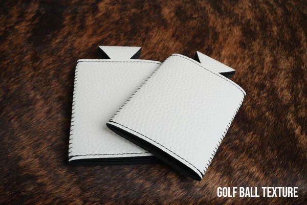 Golf Ball texture Premium Leatherette slim can coolers with a dimpled white surface, sized for slim cans.