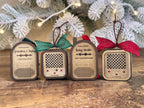 Four recordable voice ornaments in a row: Round Top Radio, Vintage Radio, Baby Monitor and a second Vintage Radio, with holiday bows
