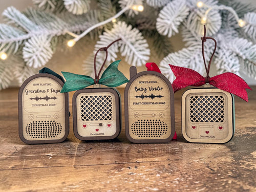 Four recordable voice ornaments in a row: Round Top Radio, Vintage Radio, Baby Monitor and a second Vintage Radio, with holiday bows