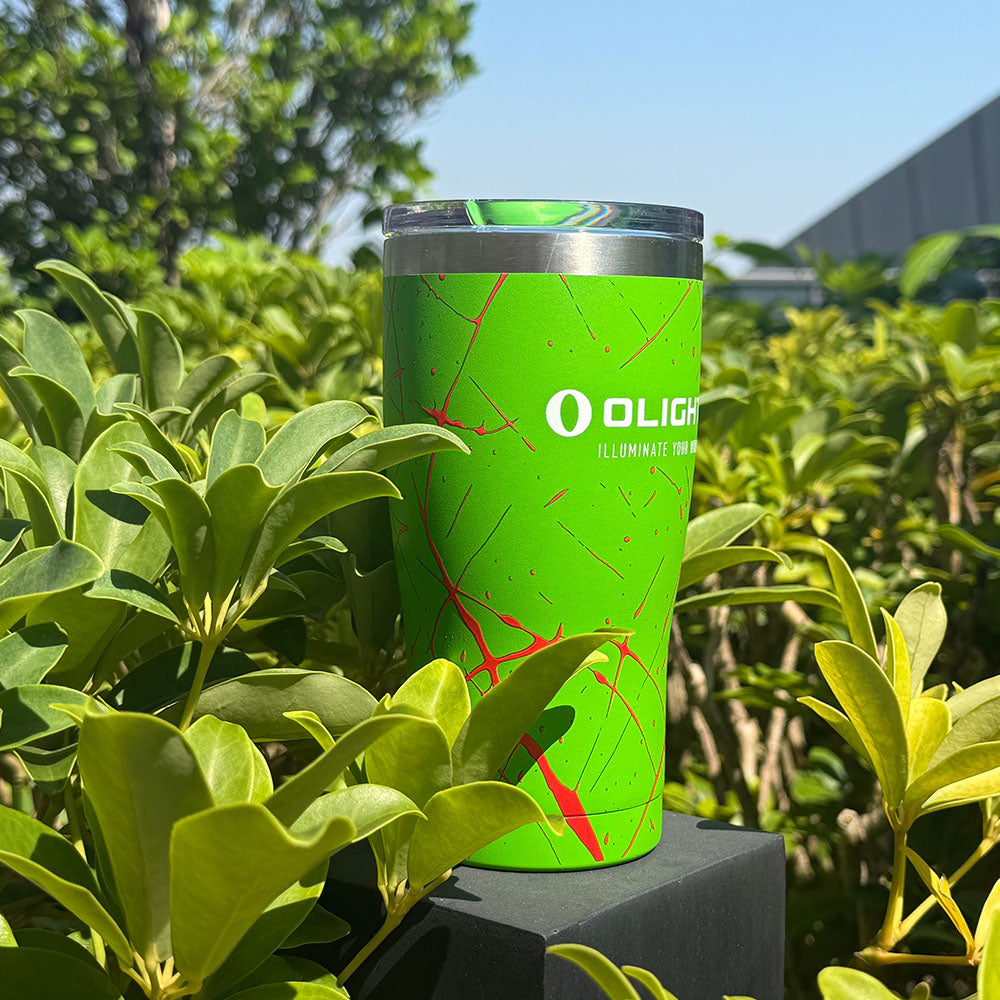 Zombie Green tumbler outdoors among green leaves