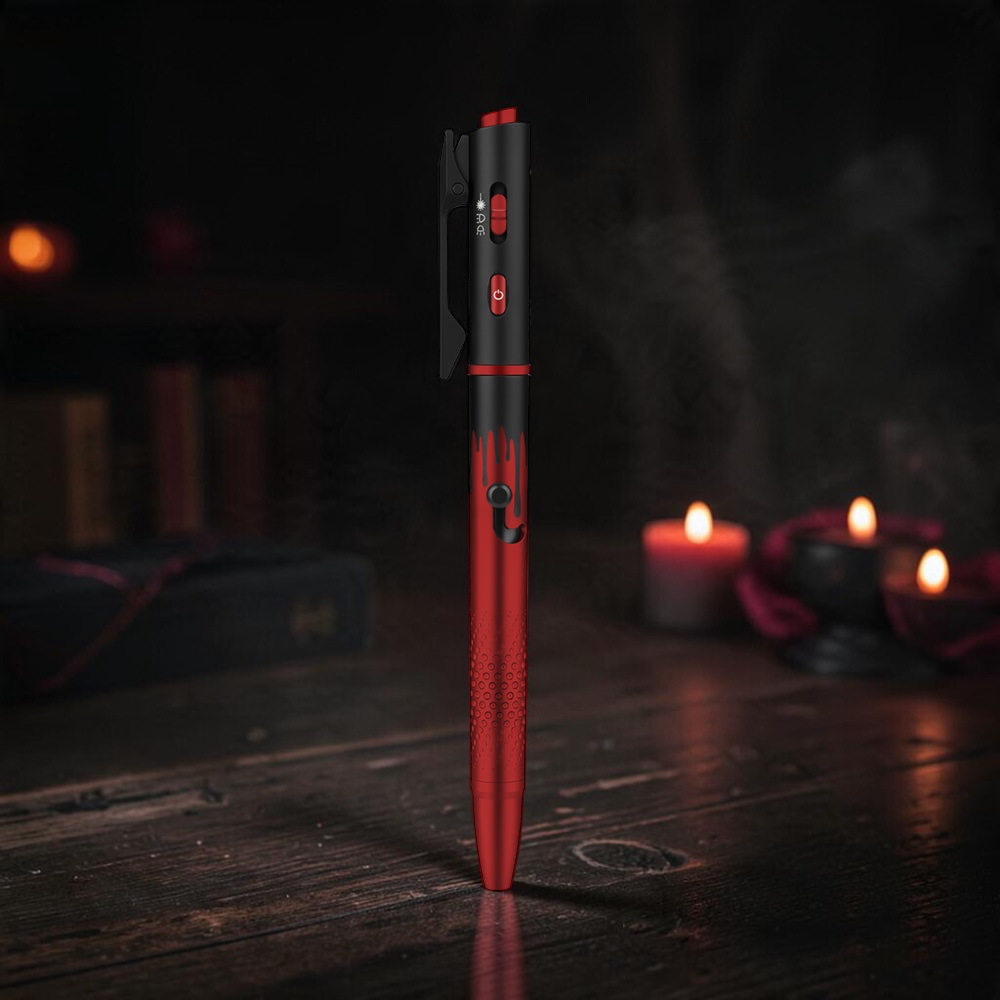 Olight O'Pen 3 penlight in Midnight Red standing on a dark table lit by red candles