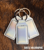 Three subtle holographic Premium Leatherette keychains with a soft iridescent pearl sheen, fanned out on a split ring.