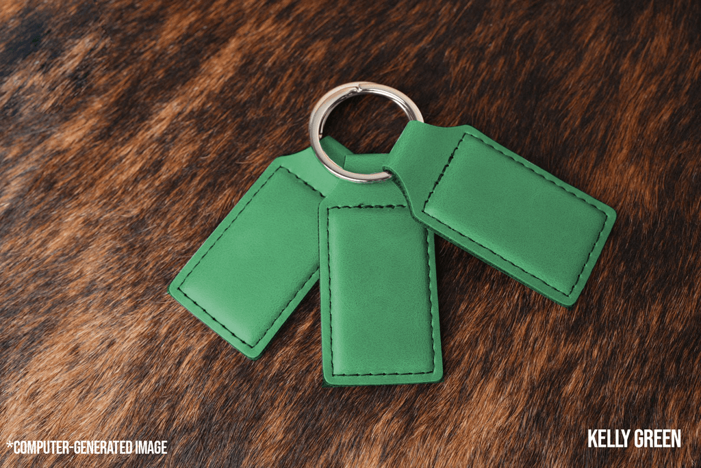 Three Kelly Green Premium Leatherette keychains fanned out on a split ring, showing the blank engraving panel.