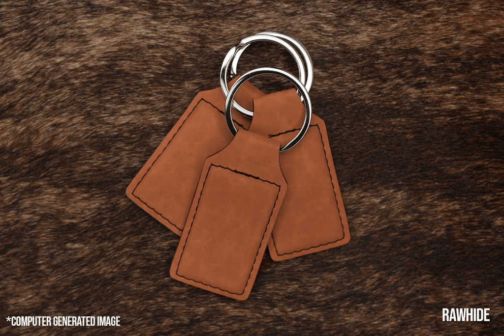 Three Rawhide tan Premium Leatherette keychains fanned out on a split ring, showing the blank engraving panel.