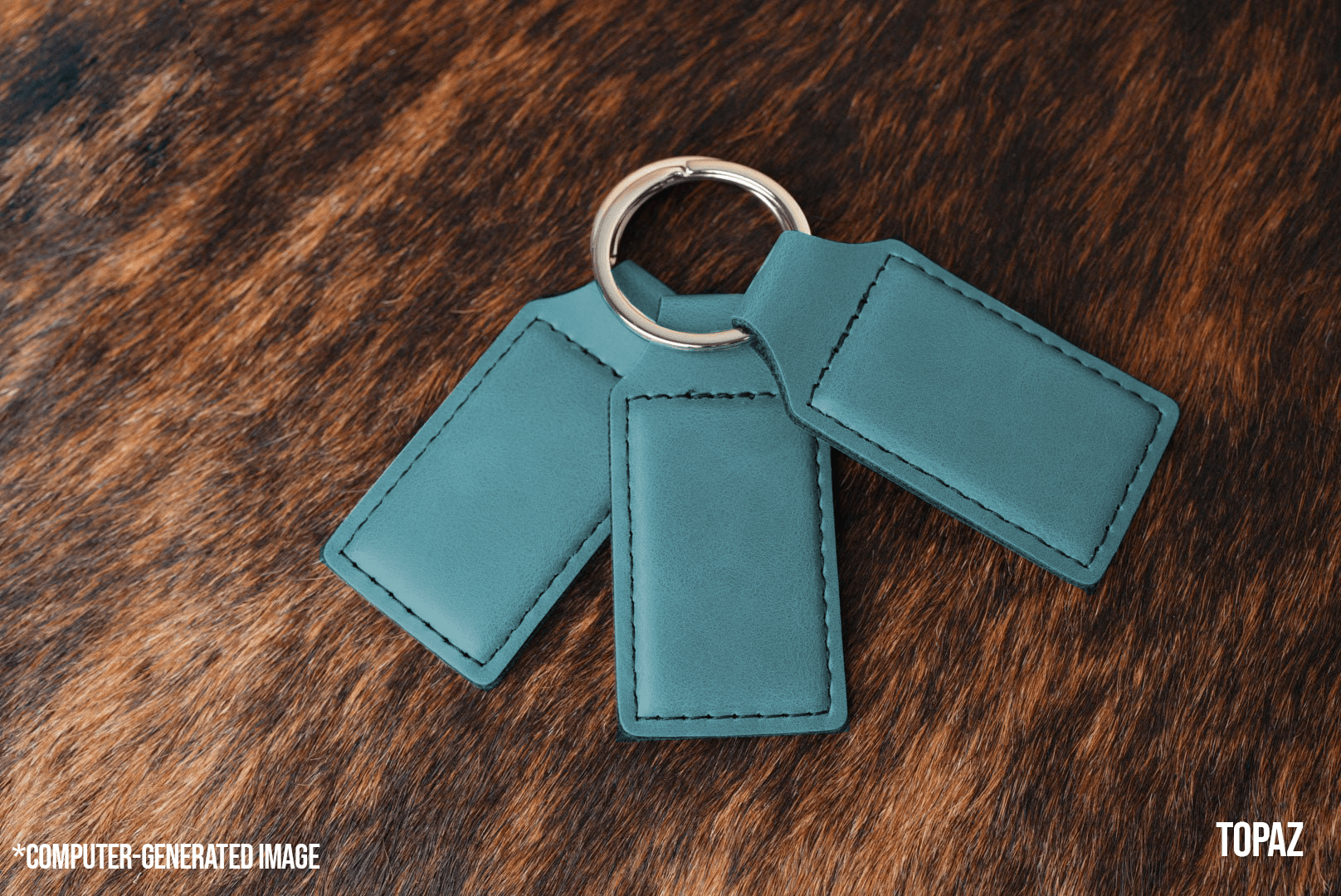 Three Topaz teal Premium Leatherette keychains fanned out on a split ring, showing the blank engraving panel.