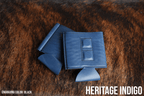 Indigo blue Premium Leatherette magnetic can coozie, standard 12 oz. size, shown folded to reveal the built-in magnets
