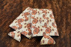 Cowhide print Premium Leatherette magnetic can coozie in brown and white, slim can size, shown folded to reveal the built-in magnets