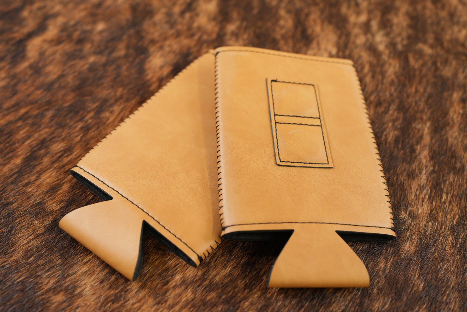 Saddle Tan Premium Leatherette magnetic can coozie, slim can size, shown folded to reveal the built-in magnets