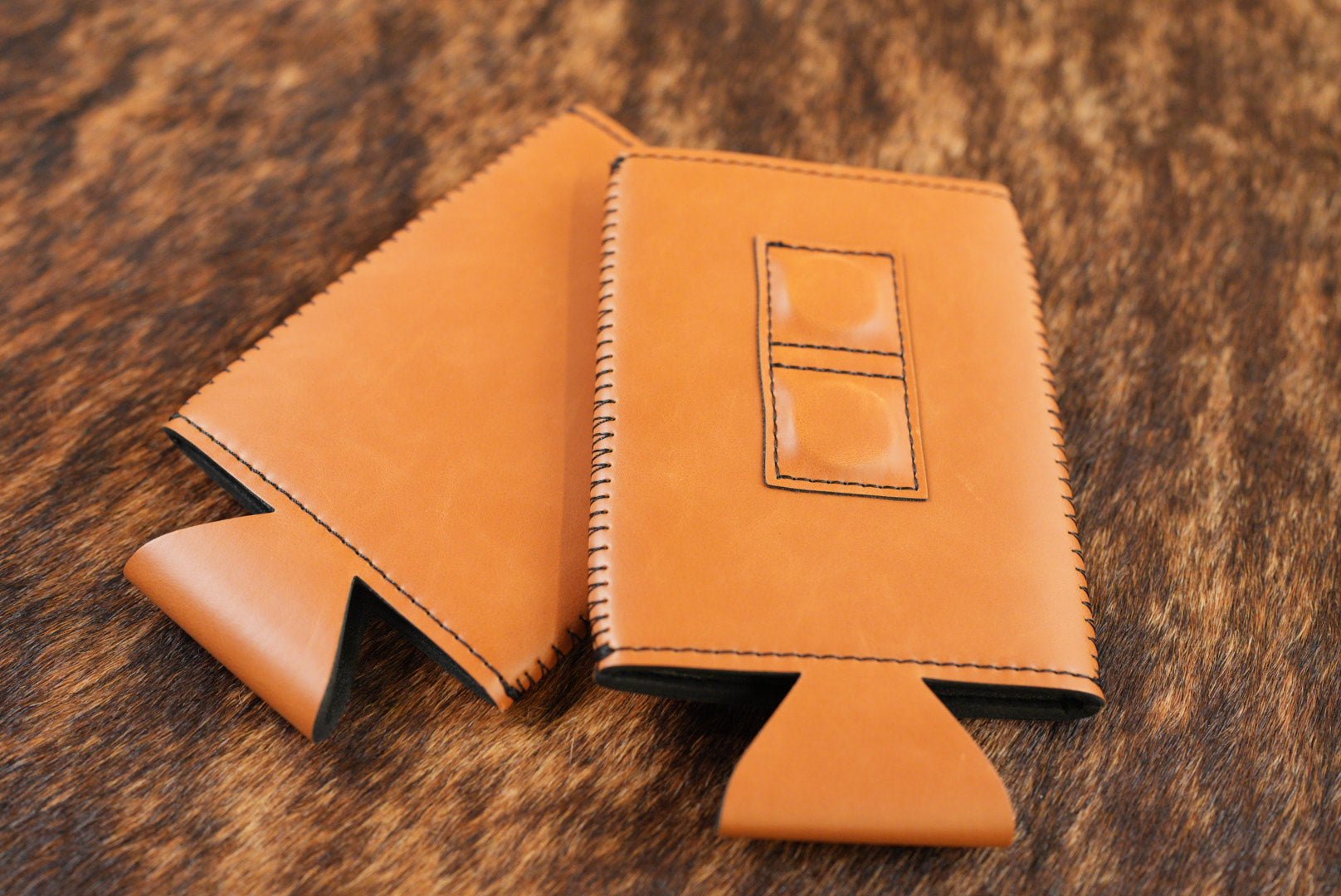 Buckskin tan Premium Leatherette magnetic can coozie, slim can size, shown folded to reveal the built-in magnets