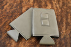 Flint grey Premium Leatherette magnetic can coozie, slim can size, shown folded to reveal the built-in magnets