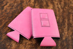 Primrose pink Premium Leatherette magnetic can coozie, slim can size, shown folded to reveal the built-in magnets