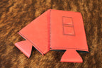 Ruby red Premium Leatherette magnetic can coozie, slim can size, shown folded to reveal the built-in magnets