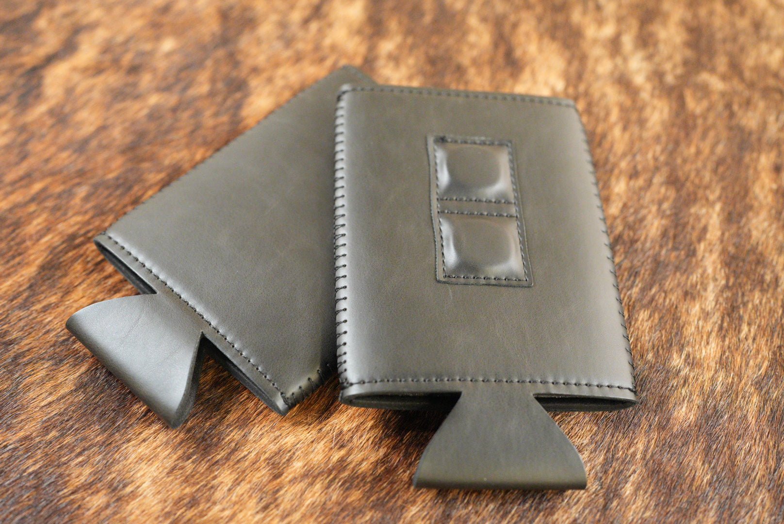 Black Premium Leatherette magnetic can coozie, slim can size, shown folded to reveal the built-in magnets