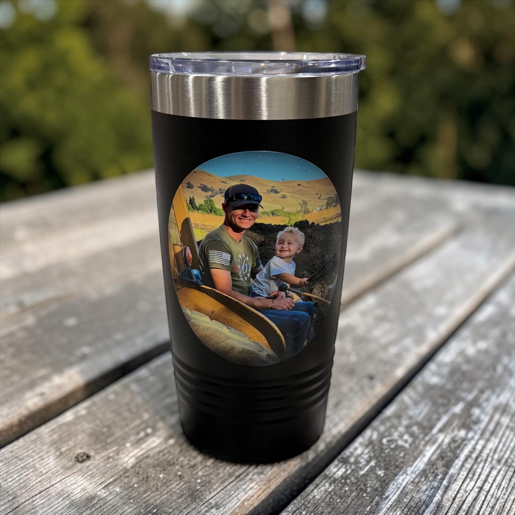 Black tumbler with a printed photo of a man and toddler riding a tractor together