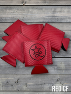 Red carbon fiber Premium Leatherette can coolers with a woven texture, shown folded on a cowhide surface.