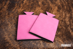 Primrose pink Premium Leatherette slim can coolers, sized for slim cans, laid flat and collapsed.