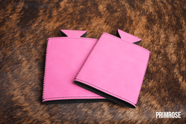 Primrose pink Premium Leatherette slim can coolers, sized for slim cans, laid flat and collapsed.