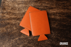 Burnt orange Premium Leatherette slim can coolers, sized for slim cans, laid flat and collapsed.