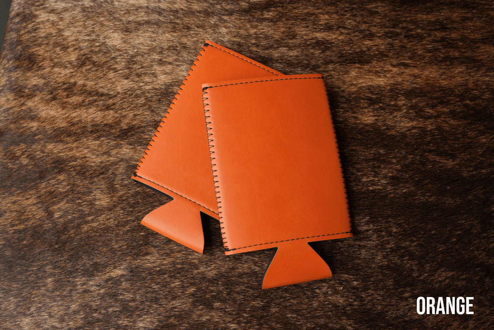 Burnt orange Premium Leatherette slim can coolers, sized for slim cans, laid flat and collapsed.