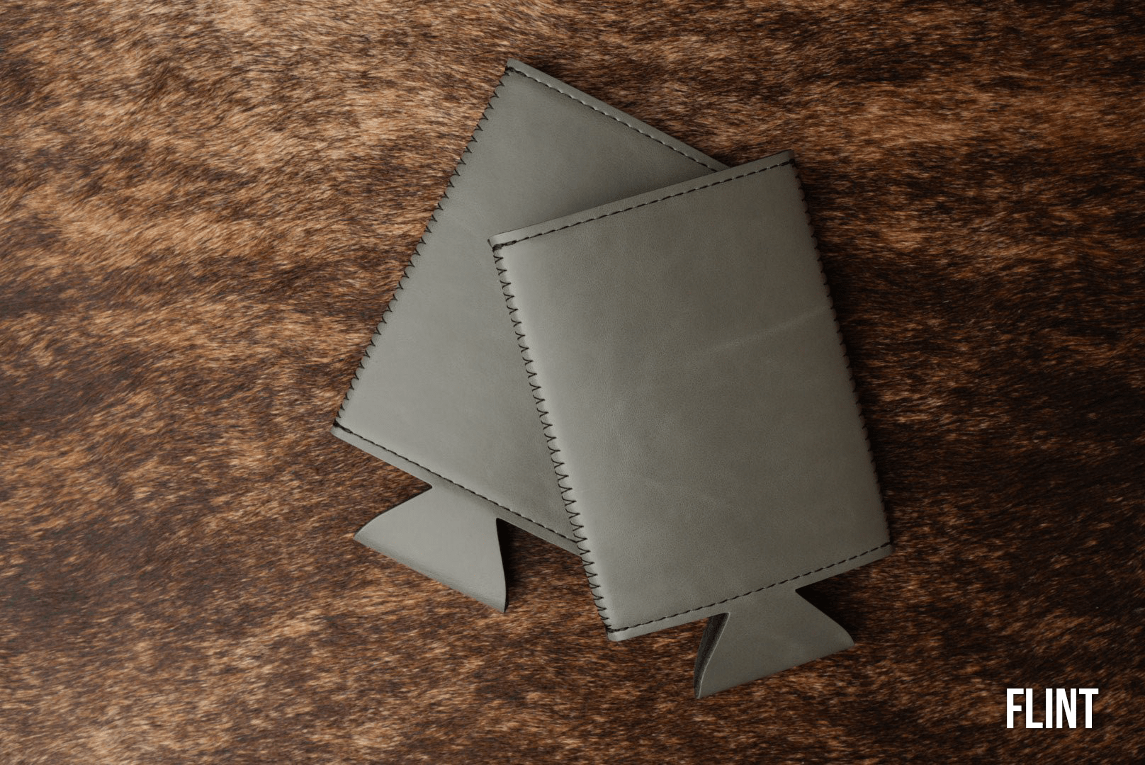 Flint grey Premium Leatherette slim can coolers, sized for slim cans, laid flat and collapsed.