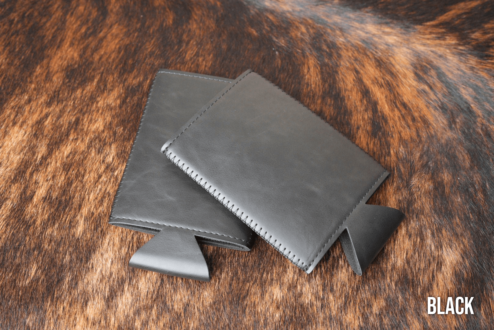 Black Premium Leatherette slim can coolers, sized for slim cans, laid flat and collapsed.