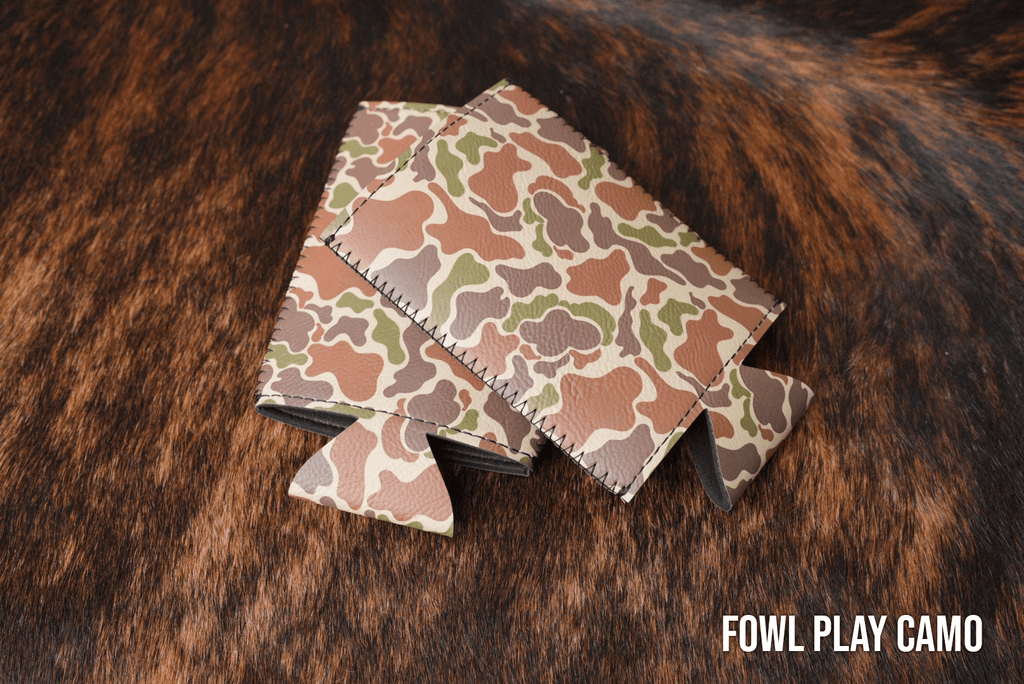Fowl Play Camo Premium Leatherette slim can coolers in a feather camouflage pattern, sized for slim cans.