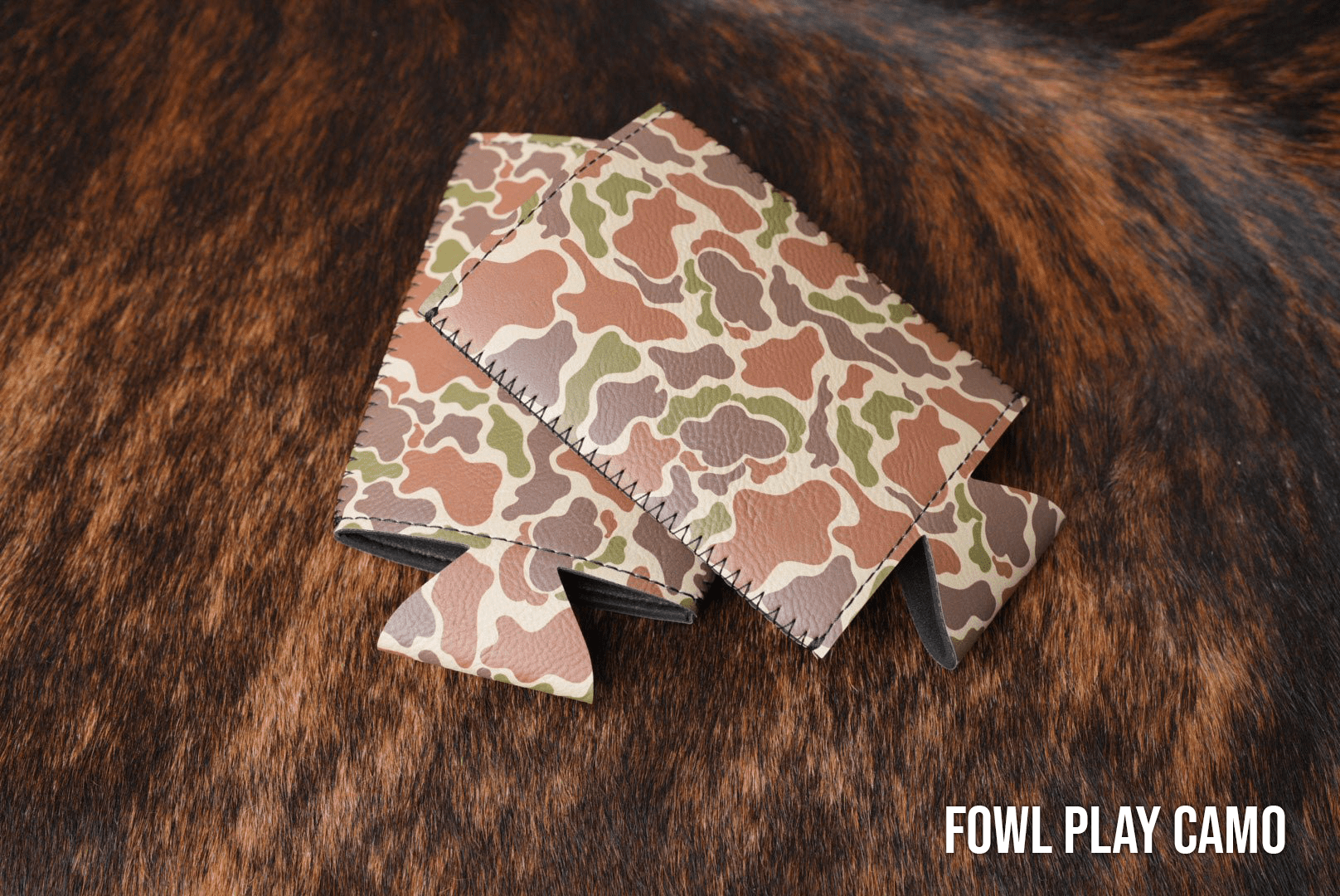 Fowl Play Camo Premium Leatherette slim can coolers in a feather camouflage pattern, sized for slim cans.