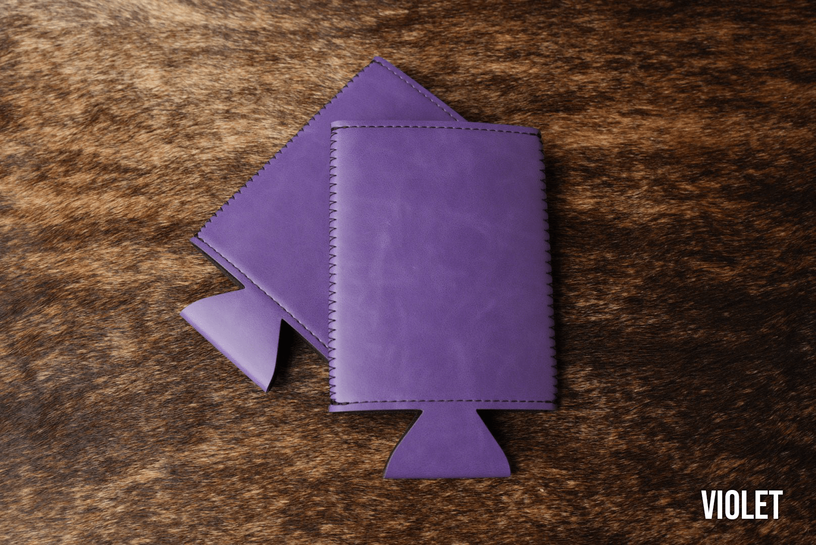 Violet purple Premium Leatherette slim can coolers, sized for slim cans, laid flat and collapsed.