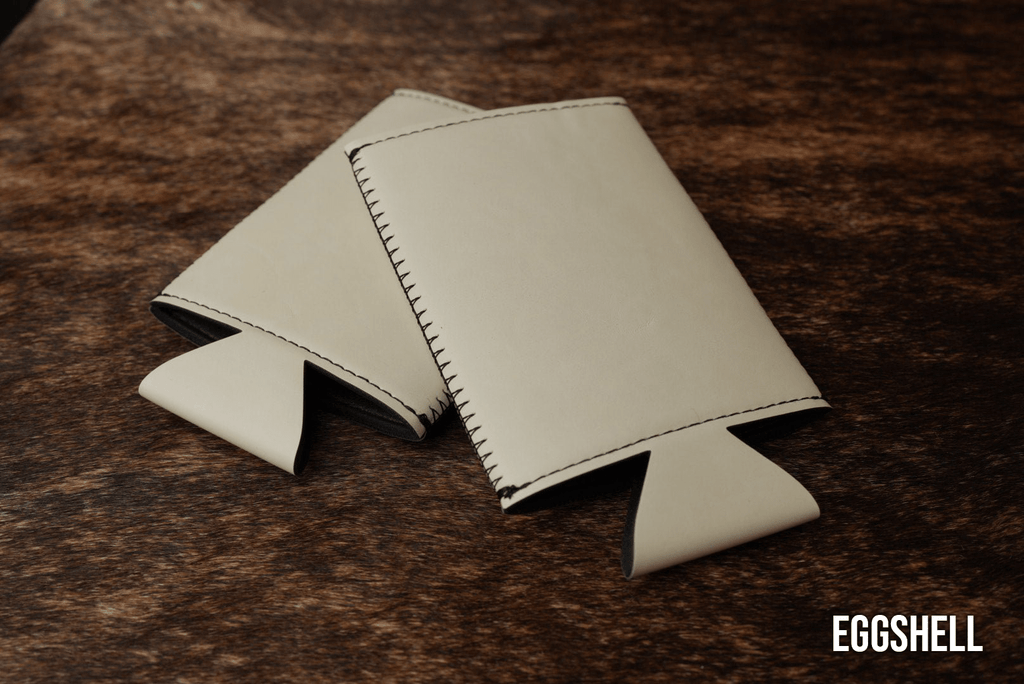 Eggshell cream Premium Leatherette slim can coolers, sized for slim cans, laid flat and collapsed.