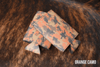 Orange Camo Premium Leatherette slim can coolers in an orange camouflage pattern, sized for slim cans.