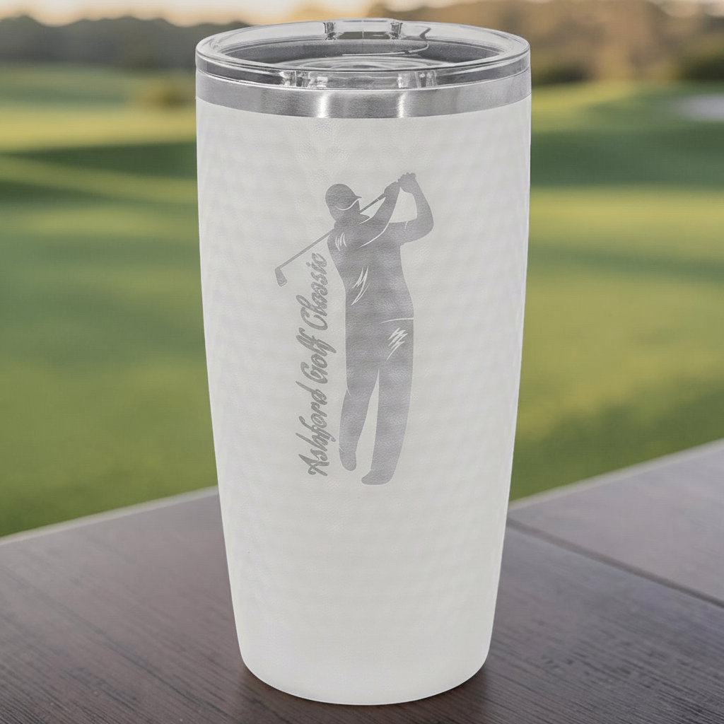 Solano Laser Craft white 20 oz. golf ball textured stainless steel tumbler with a custom engraved golfer design.