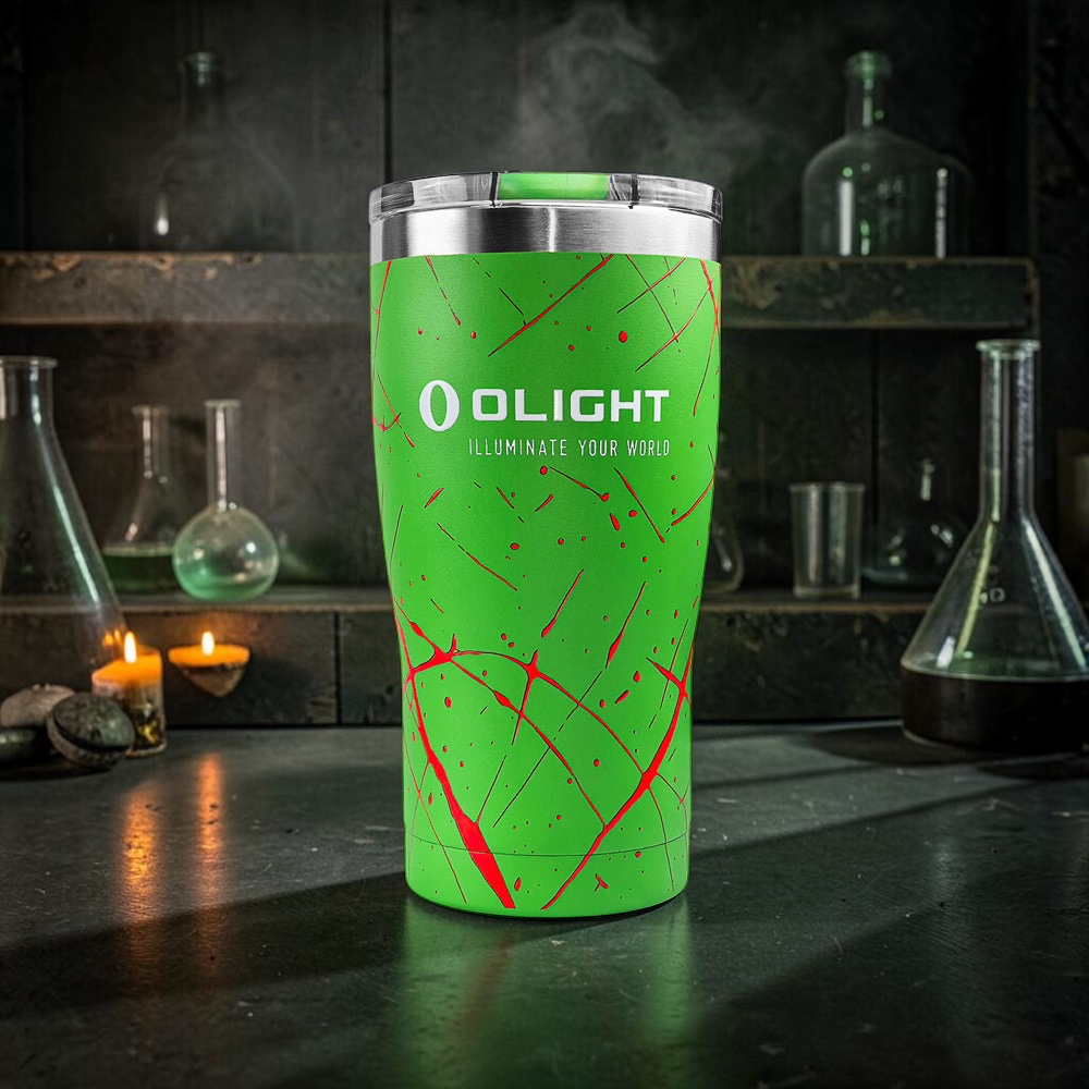 Olight Zombie Green tumbler with blood-red splatter on a mad scientist's bench, glowing green flasks and candles behind it