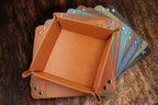 Leatherette valet trays fanned out to show the range of available colors