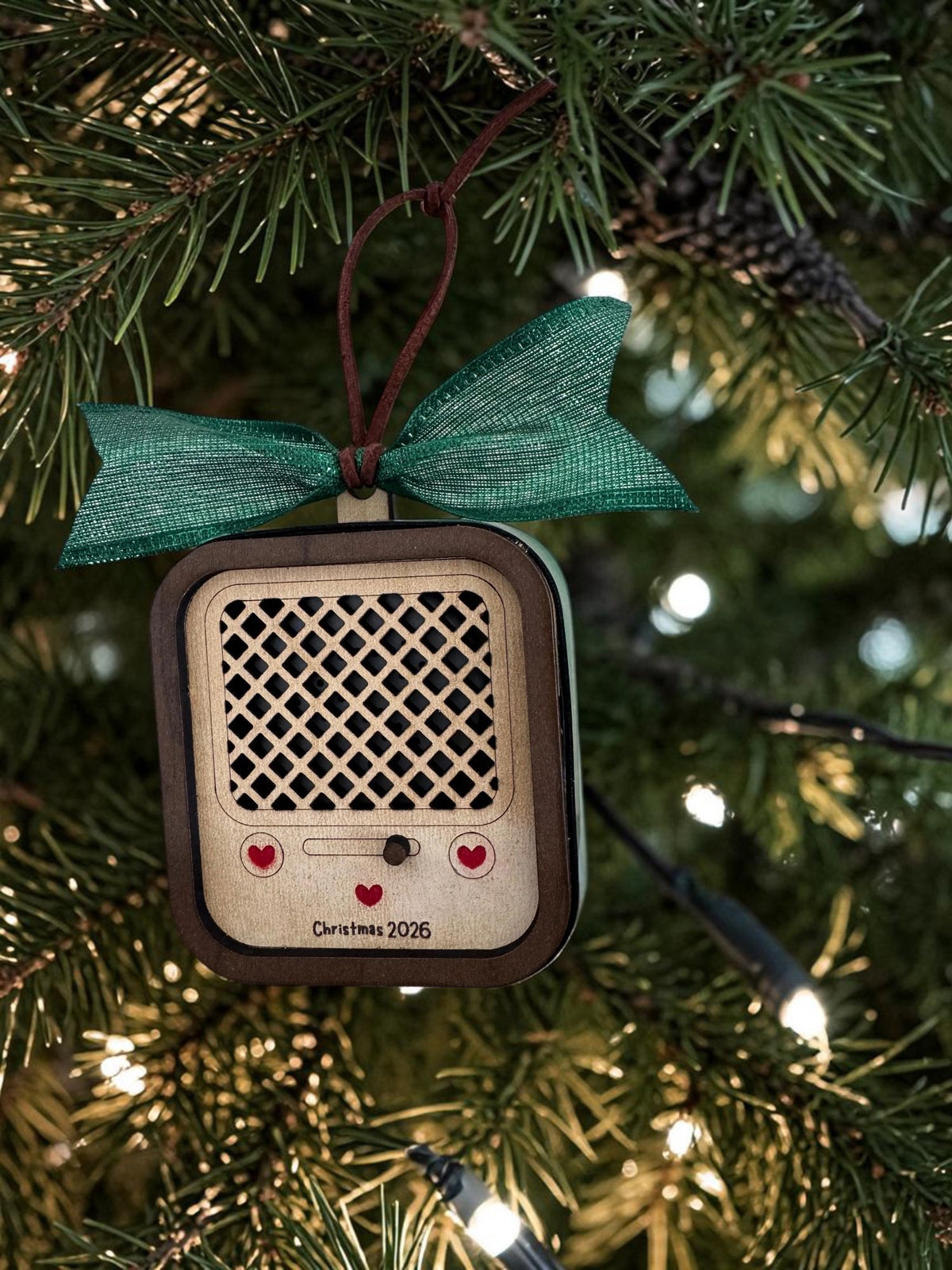 Vintage Radio recordable ornament with a dark wood frame, red hearts and Christmas 2026, green bow, hanging on a tree